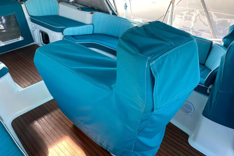 Slide: The Image of Interior of 2008 Jeanneau Sun Odyssey 54 DS with blue seating and wooden flooring. - 25