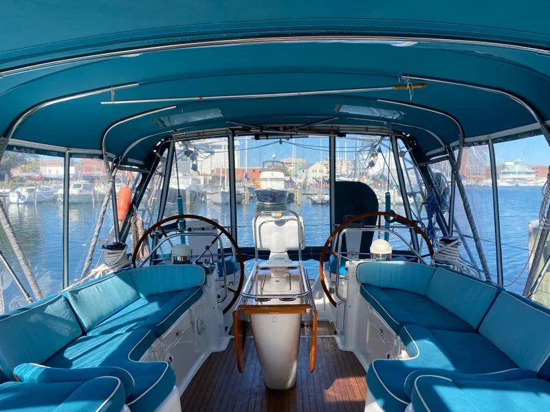 Slide: The Image of Interior view of 2008 Jeanneau Sun Odyssey 54 DS yacht with blue seating and dual steering wheels. - 28