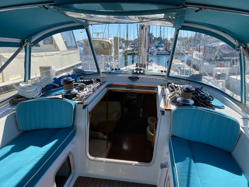 Slide: The Image of Cockpit of 2008 Jeanneau Sun Odyssey 54 DS sailboat with blue seating and canopy. - 29