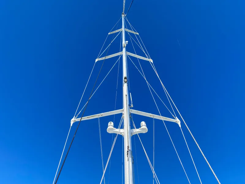Slide: The Image of Mast of 2008 Jeanneau Sun Odyssey 54 DS against clear blue sky. - 3