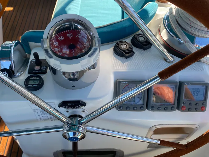 Slide: The Image of Cockpit of 2008 Jeanneau Sun Odyssey 54 DS with navigation instruments and compass. - 34