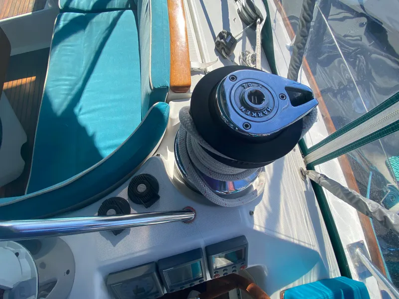 Slide: The Image of Cockpit view of 2008 Jeanneau Sun Odyssey 54 DS sailboat with winch and teal seating. - 36