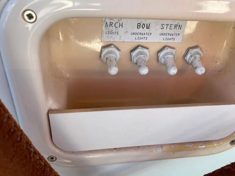 Slide: The Image of Control panel with switches for arch, bow, and stern lights on a 2008 Jeanneau Sun Odyssey 54 DS. - 38