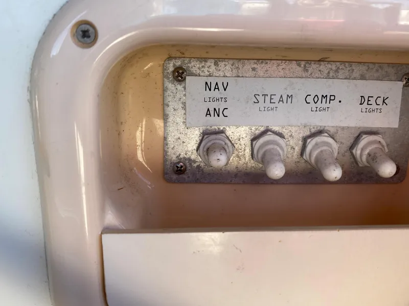 Slide: The Image of Control panel with switches for navigation, steam, compass, and deck lights on Jeanneau Sun Odyssey 54 DS. - 39