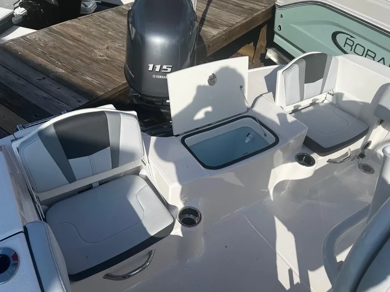 Slide: The Image of 2025 Robalo R180 Center Console boat interior with seating and storage compartments. - 7