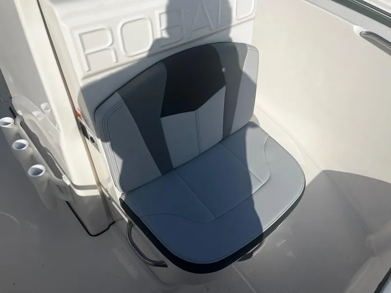 Slide: The Image of 2025 Robalo R180 Center Console boat seat with sleek gray upholstery. - 9