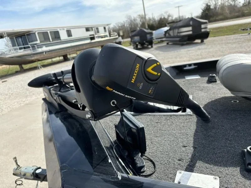 Slide: The Image of 2012 Lowe Stinger 18 HP boat interior with seating and fishing gear. - 5