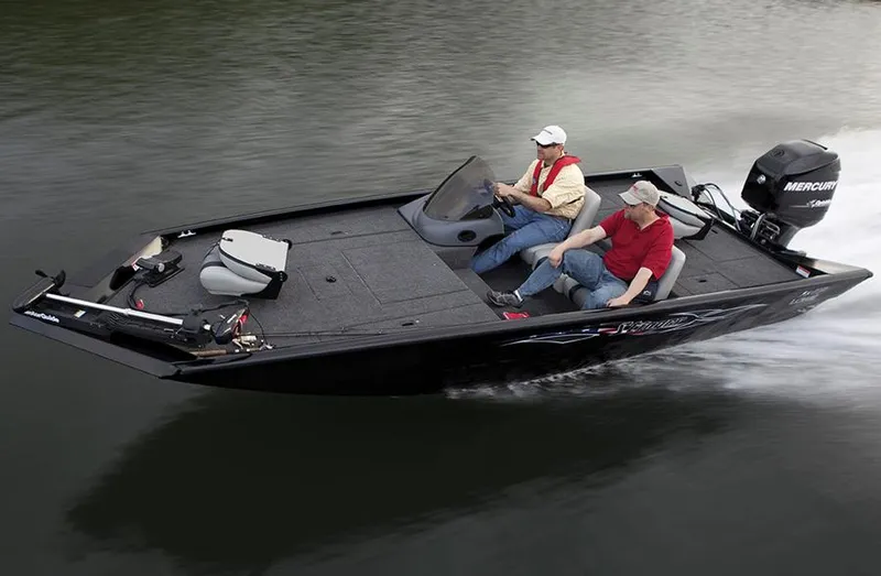 Slide: The Image of 2012 Lowe Stinger 18 HP boat interior with steering console and seating. - 8