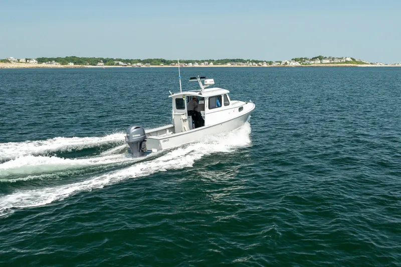 Slide: The Image of 2021 Beal Calvin Beal 25 Custom boat cruising on open water. - 11