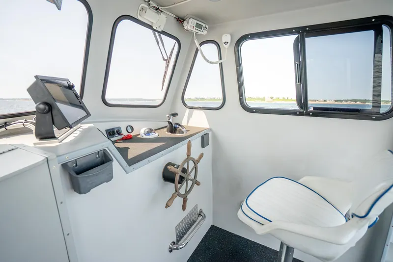 Slide: The Image of Interior of 2021 Beal Calvin Beal 25 Custom boat, featuring helm and seating. - 14