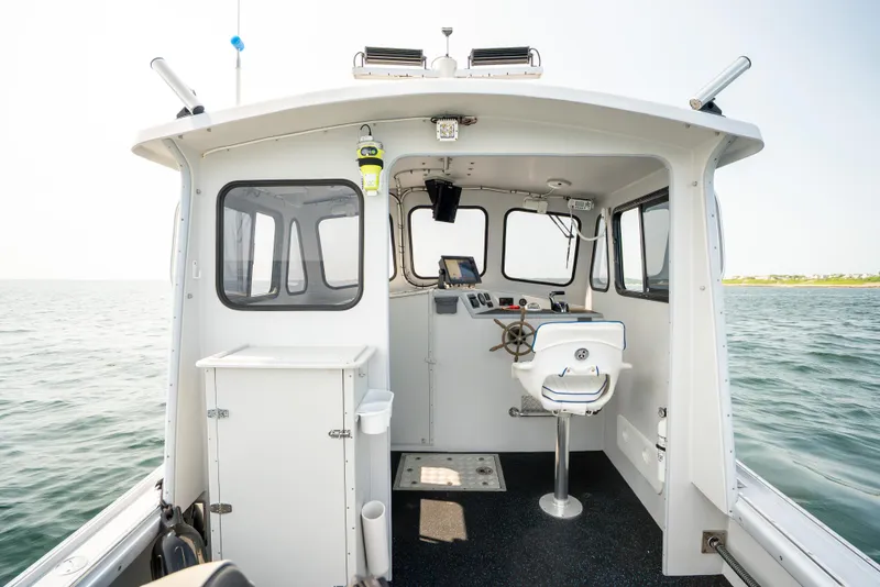 Slide: The Image of 2021 Beal Calvin Beal 25 Custom boat interior with steering console and seating. - 18