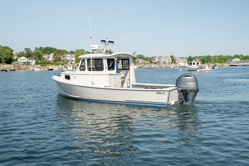 Slide: The Image of 2021 Beal Calvin Beal 25 Custom boat on calm water near coastal homes. - 3