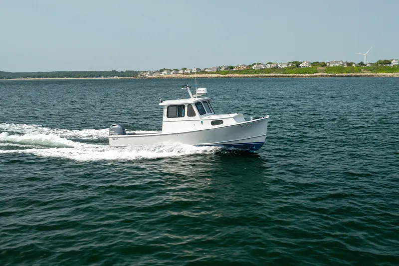 Slide: The Image of 2021 Beal Calvin Beal 25 Custom boat cruising on open water near coastline. - 4