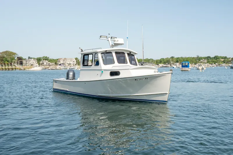 Slide: The Image of 2021 Beal Calvin Beal 25 Custom boat on calm water, with coastal background. - 5