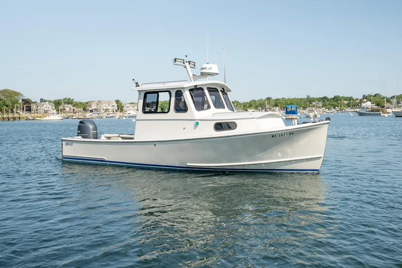 Slide: The Image of 2021 Beal Calvin Beal 25 Custom boat on calm water, clear sky background. - 9