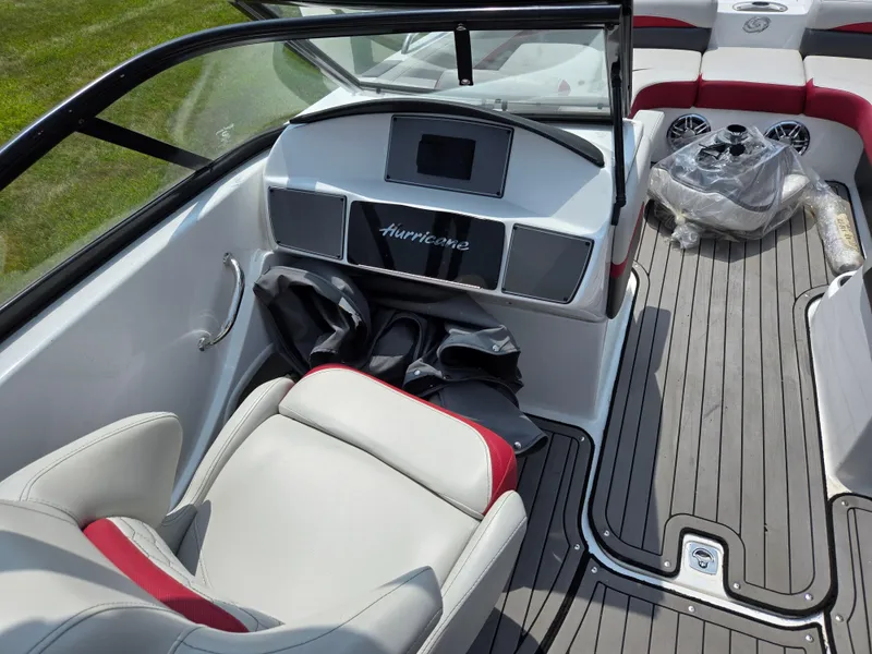 Slide: The Image of 2021 Hurricane SunDeck 217 OB boat interior with modern dashboard and seating. - 12