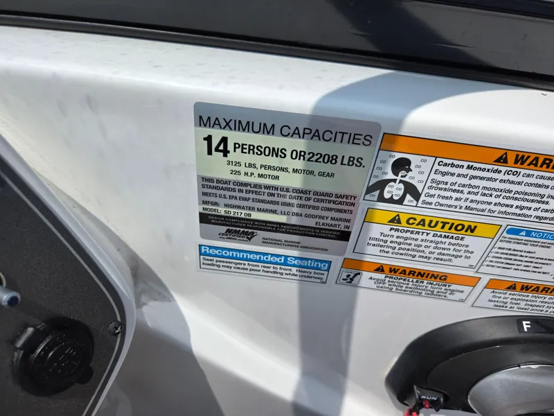 Slide: The Image of 2021 Hurricane SunDeck 217 OB capacity label, maximum 14 persons or 2208 lbs. - 14