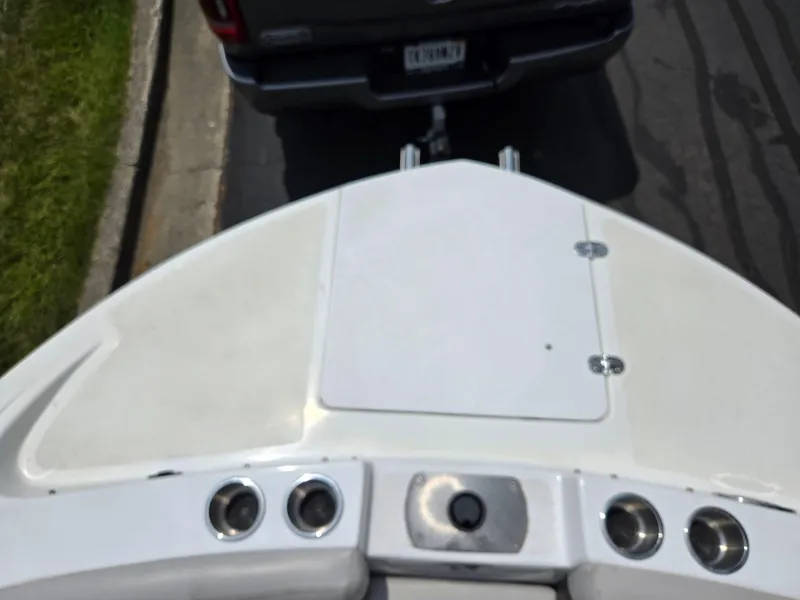 Slide: The Image of 2021 Hurricane SunDeck 217 OB boat being towed by a vehicle on a street. - 19