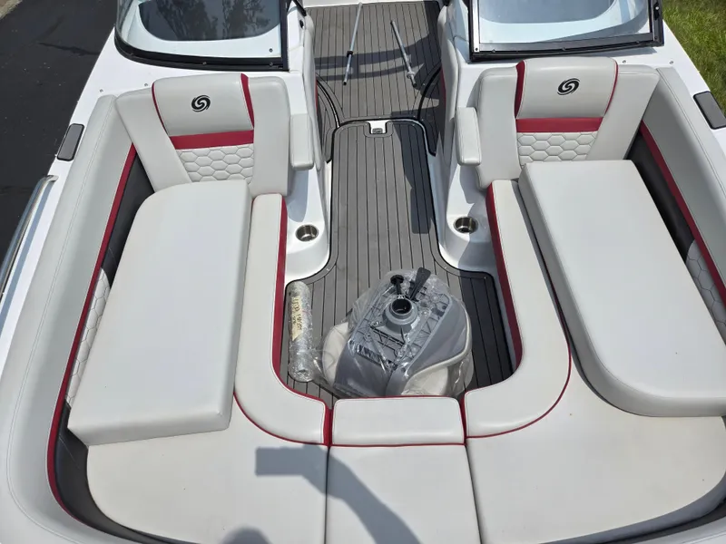 Slide: The Image of 2021 Hurricane SunDeck 217 OB boat interior with white and red seating. - 20