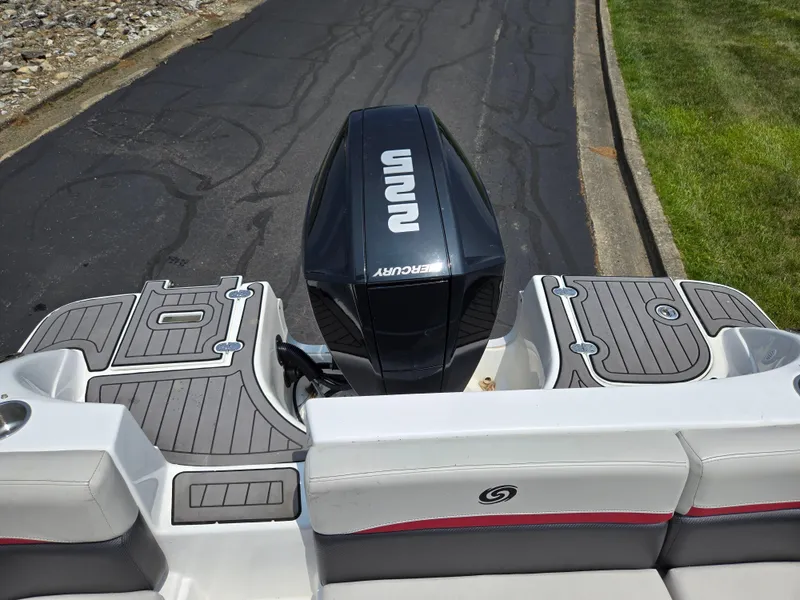 Slide: The Image of 2021 Hurricane SunDeck 217 OB boat with Mercury outboard motor, viewed from the rear. - 24