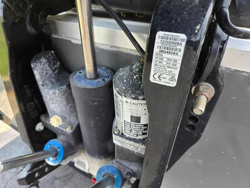 Slide: The Image of Close-up of 2021 Hurricane SunDeck 217 OB boat engine components. - 25