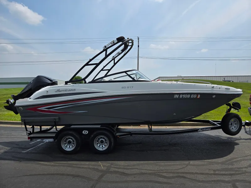 Slide: The Image of 2021 Hurricane SunDeck 217 OB boat on trailer, side view, outdoors. - 4