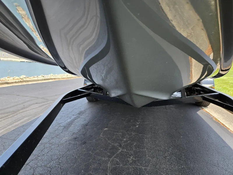 Slide: The Image of 2021 Hurricane SunDeck 217 OB boat hull on trailer, close-up view. - 7