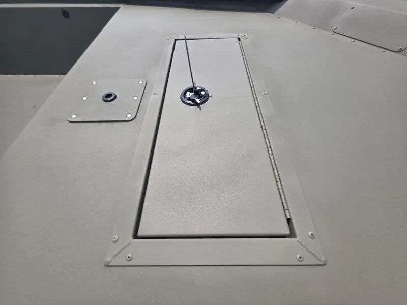 Slide: The Image of 2025 Tracker Grizzly 1648 Utility boat deck with storage compartment. - 10