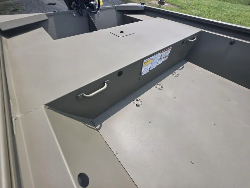 Slide: The Image of 2025 Tracker Grizzly 1648 Utility boat interior with storage compartment and handles. - 12