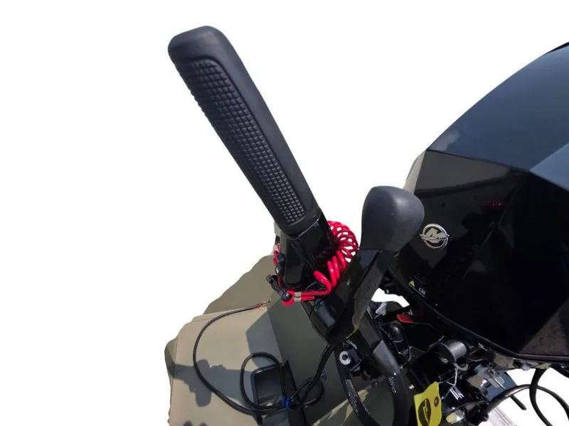Slide: The Image of 2025 Tracker Grizzly 1648 Utility boat motor controls with red safety cord. - 3
