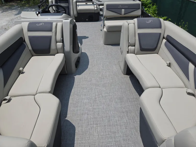 Slide: The Image of 2023 Barletta Cabrio 24UE pontoon boat interior with plush seating and modern design. - 11