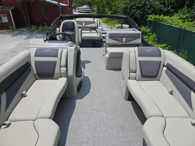 Slide: The Image of 2023 Barletta Cabrio 24UE pontoon boat with spacious seating and modern design. - 12