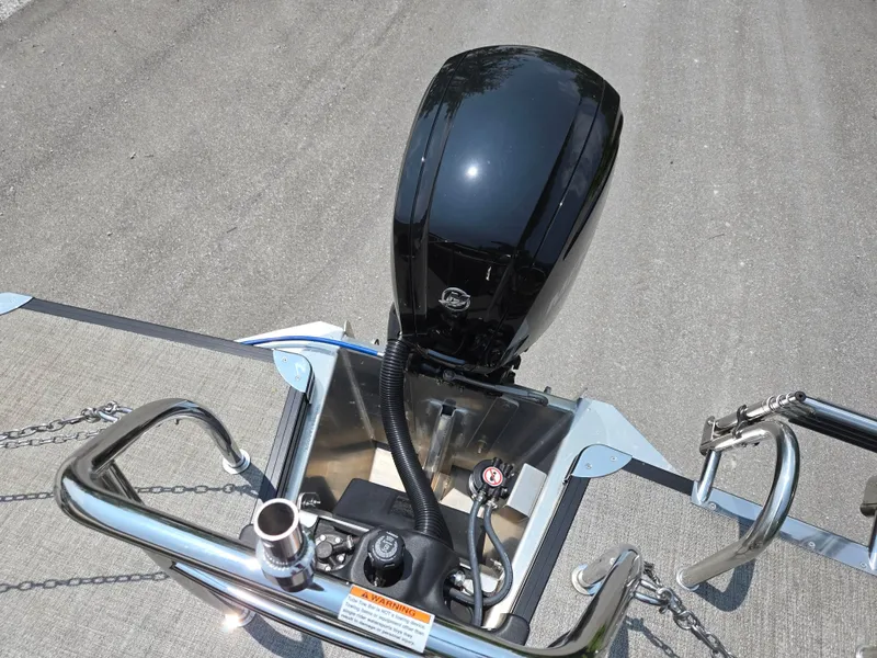 Slide: The Image of 2023 Barletta Cabrio 24UE boat engine and railing, top view. - 22