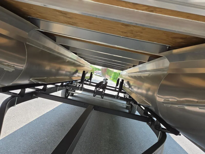 Slide: The Image of Underneath view of 2023 Barletta Cabrio 24UE pontoon boat on a trailer. - 7