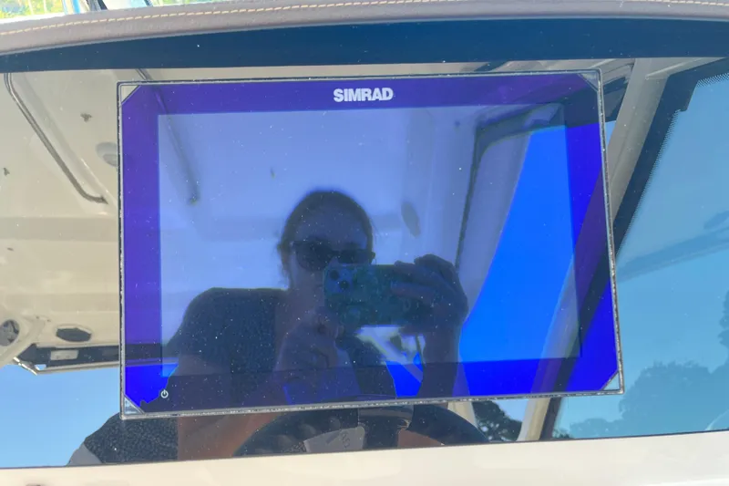 Slide: The Image of Simrad display on 2026 Boston Whaler 280 Vantage boat dashboard. - 13