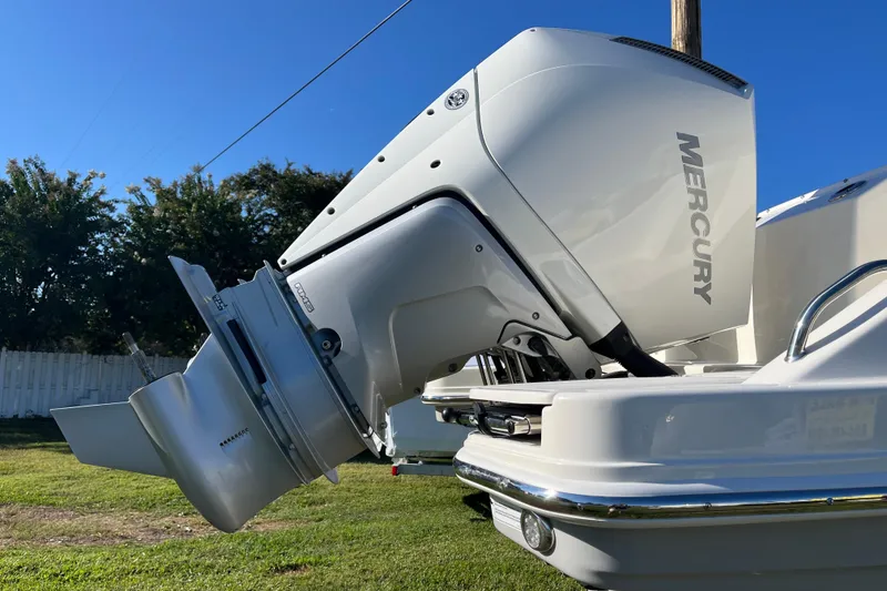Slide: The Image of 2026 Boston Whaler 280 Vantage with Mercury outboard engine, side view. - 2