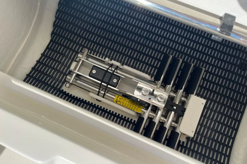 Slide: The Image of Storage compartment in 2026 Boston Whaler 280 Vantage boat, featuring a folded ladder. - 22