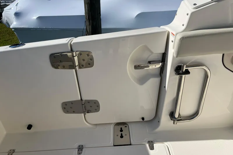 Slide: The Image of 2026 Boston Whaler 280 Vantage boat door with stainless steel hinges and handle. - 23
