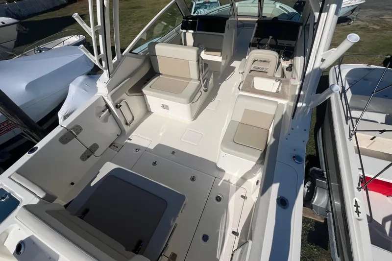 Slide: The Image of 2026 Boston Whaler 280 Vantage boat interior with seating and storage compartments. - 3