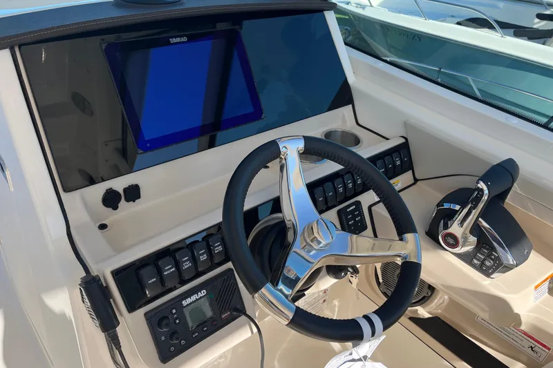 Slide: The Image of 2026 Boston Whaler 280 Vantage helm with modern controls and navigation system. - 4
