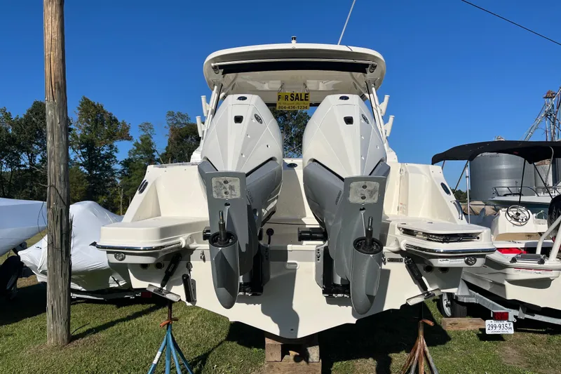 Slide: The Image of 2026 Boston Whaler 280 Vantage boat with dual engines, displayed for sale outdoors. - 42
