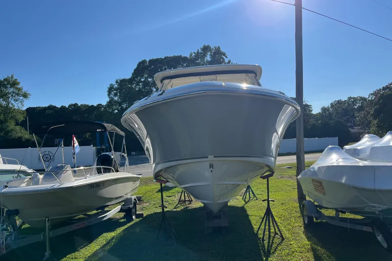 Slide: The Image of 2026 Boston Whaler 280 Vantage boat displayed outdoors on a sunny day. - 44