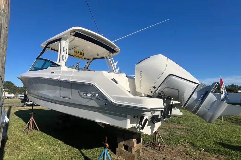 Slide: The Image of 2026 Boston Whaler 280 Vantage boat for sale, displayed on stands outdoors. - 47