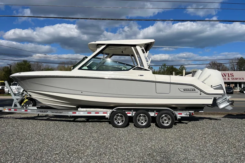 Slide: The Image of 2026 Boston Whaler 280 Vantage boat on trailer under blue sky. - 48