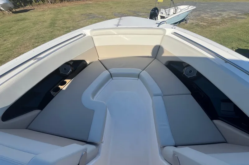 Slide: The Image of 2026 Boston Whaler 280 Vantage boat interior with cushioned seating and speakers. - 8