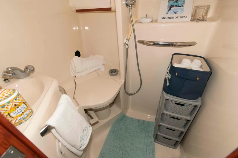 Slide: The Image of Bathroom of 1998 Sea Ray 450 Sundancer yacht with shower and storage. - 19