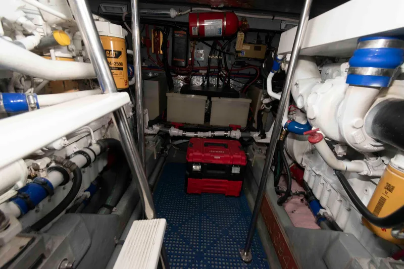 Slide: The Image of Engine room of 1998 Sea Ray 450 Sundancer with visible machinery and equipment. - 20