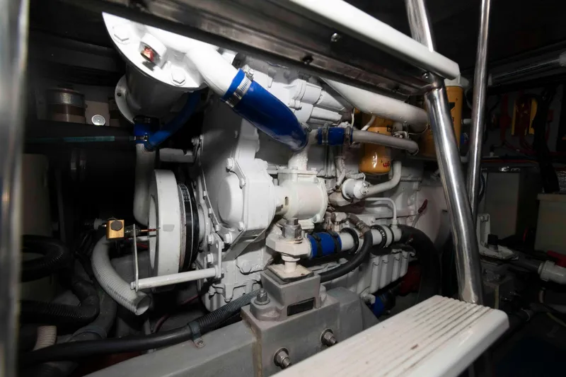 Slide: The Image of Engine room of a 1998 Sea Ray 450 Sundancer yacht, showcasing mechanical components. - 21