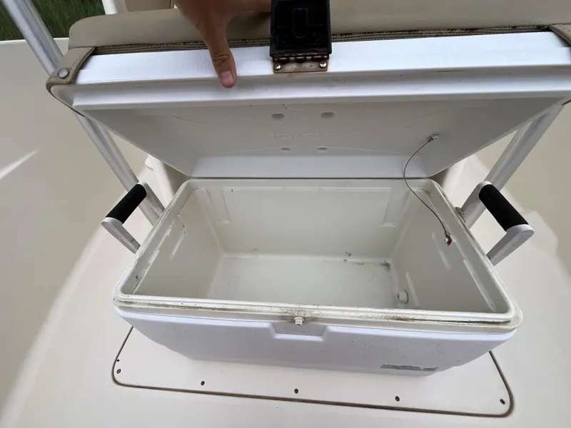 Slide: The Image of Open storage compartment on 2014 Scout 195 Sportfish boat, showcasing interior space. - 17