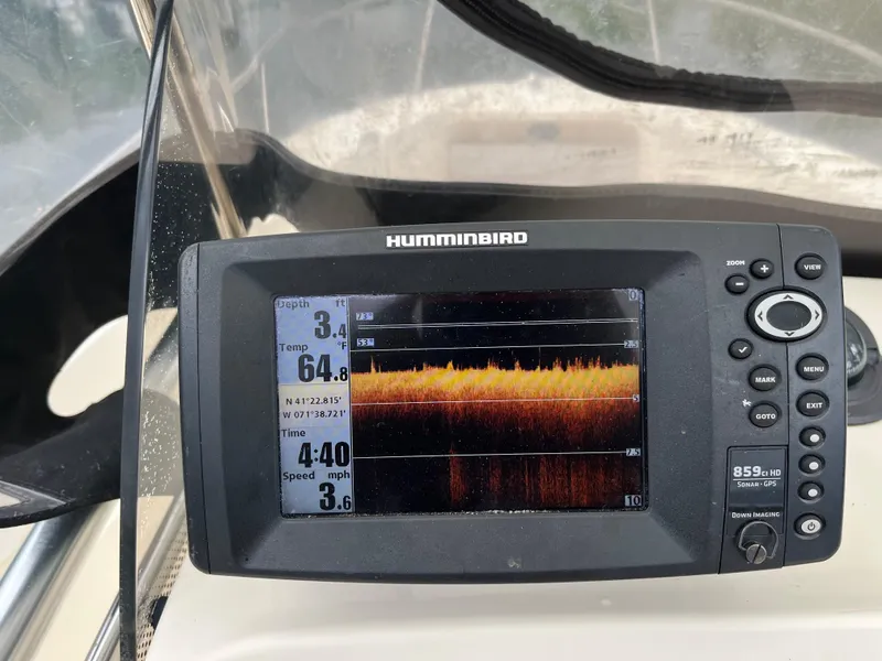 Slide: The Image of Fishfinder display on 2014 Scout 195 Sportfish boat, showing temperature and speed data. - 27